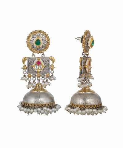 Ornate earrings with gold, silver, and gemstone details on a white background