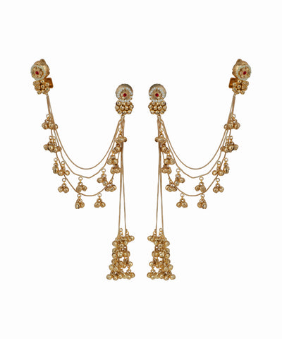 Gold earrings with dangling beads on a white background