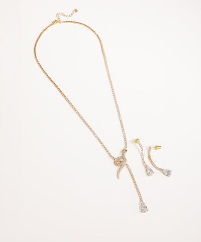 Gold-tone necklace with CZ stones in a knot and drop design, with matching earrings
