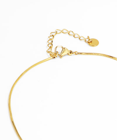Gold necklace on a white background