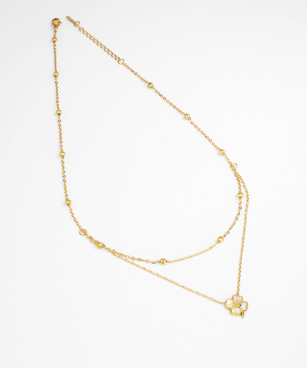 Gold necklace on a white background