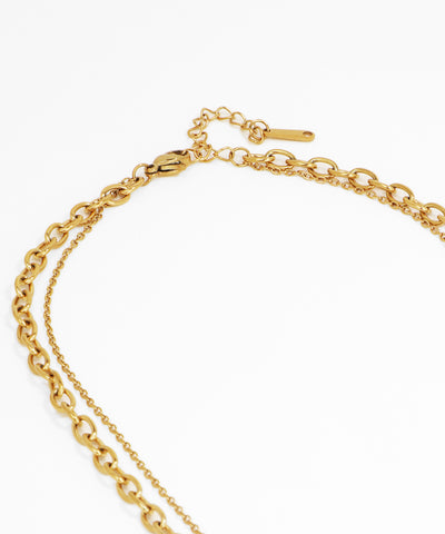Gold chain bracelet on a white background