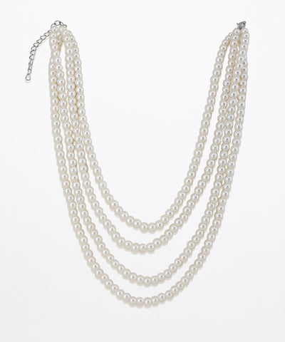 Silver-tone triple strand necklace with white faux pearls and an extender chain