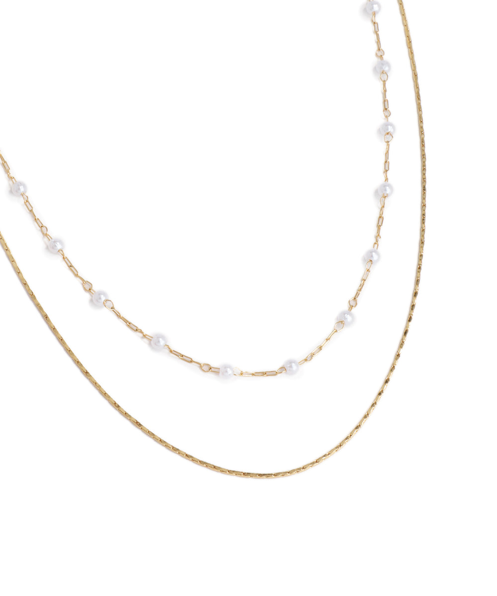 Two pearl necklaces on a white background