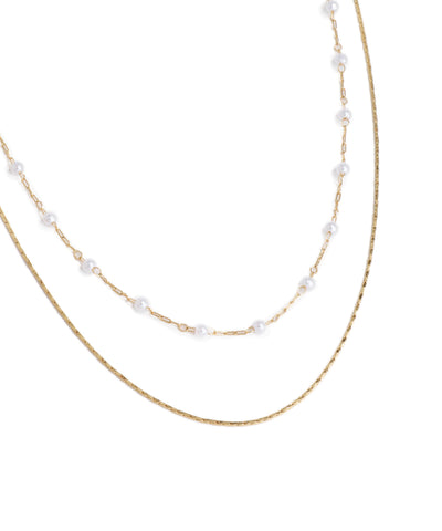 Two pearl necklaces on a white background