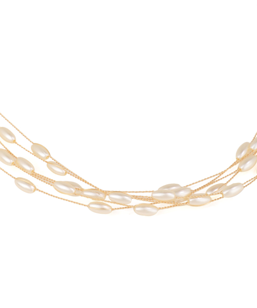 Multi-strand pearl necklace on a white background