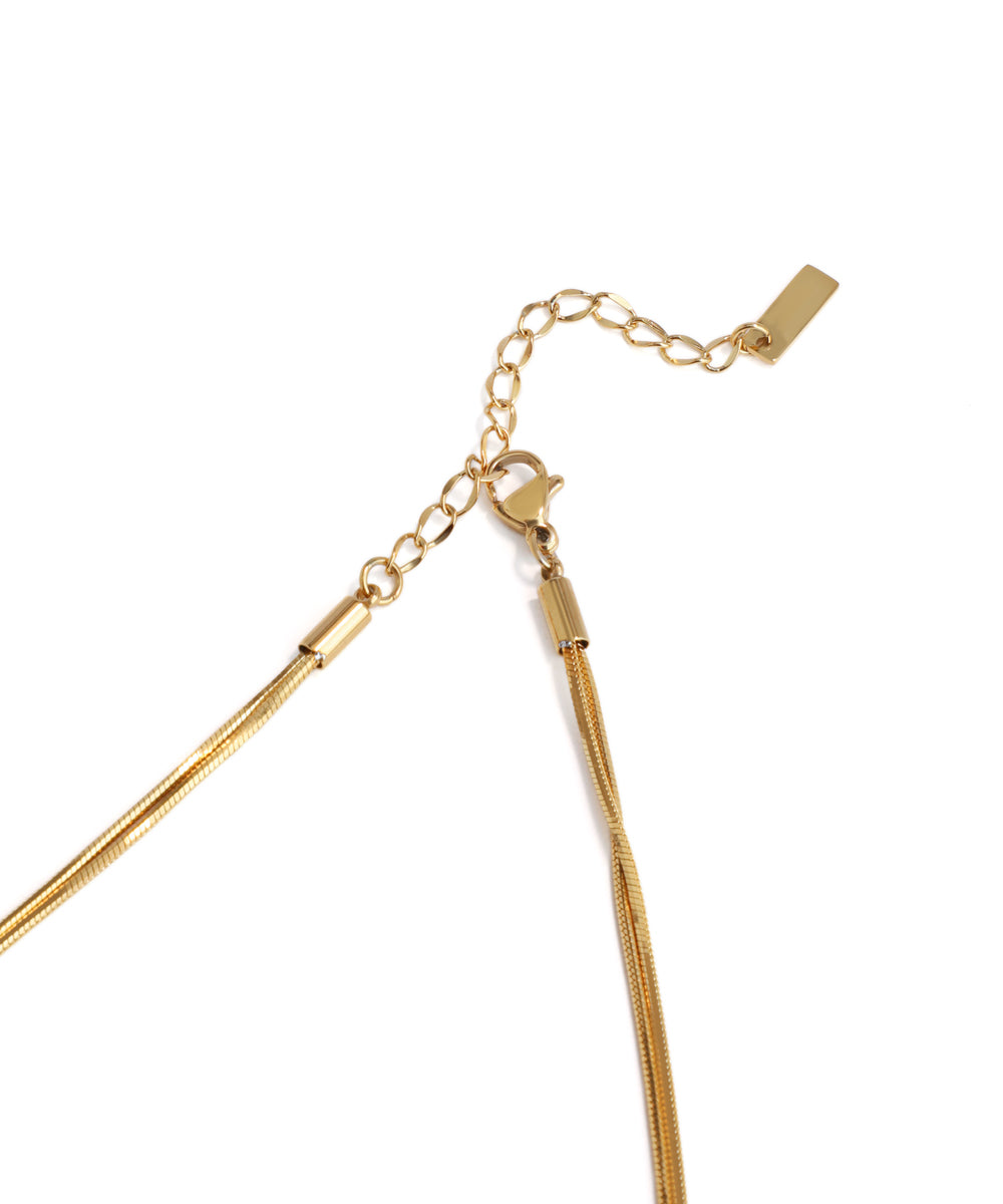 Gold necklace on a white background