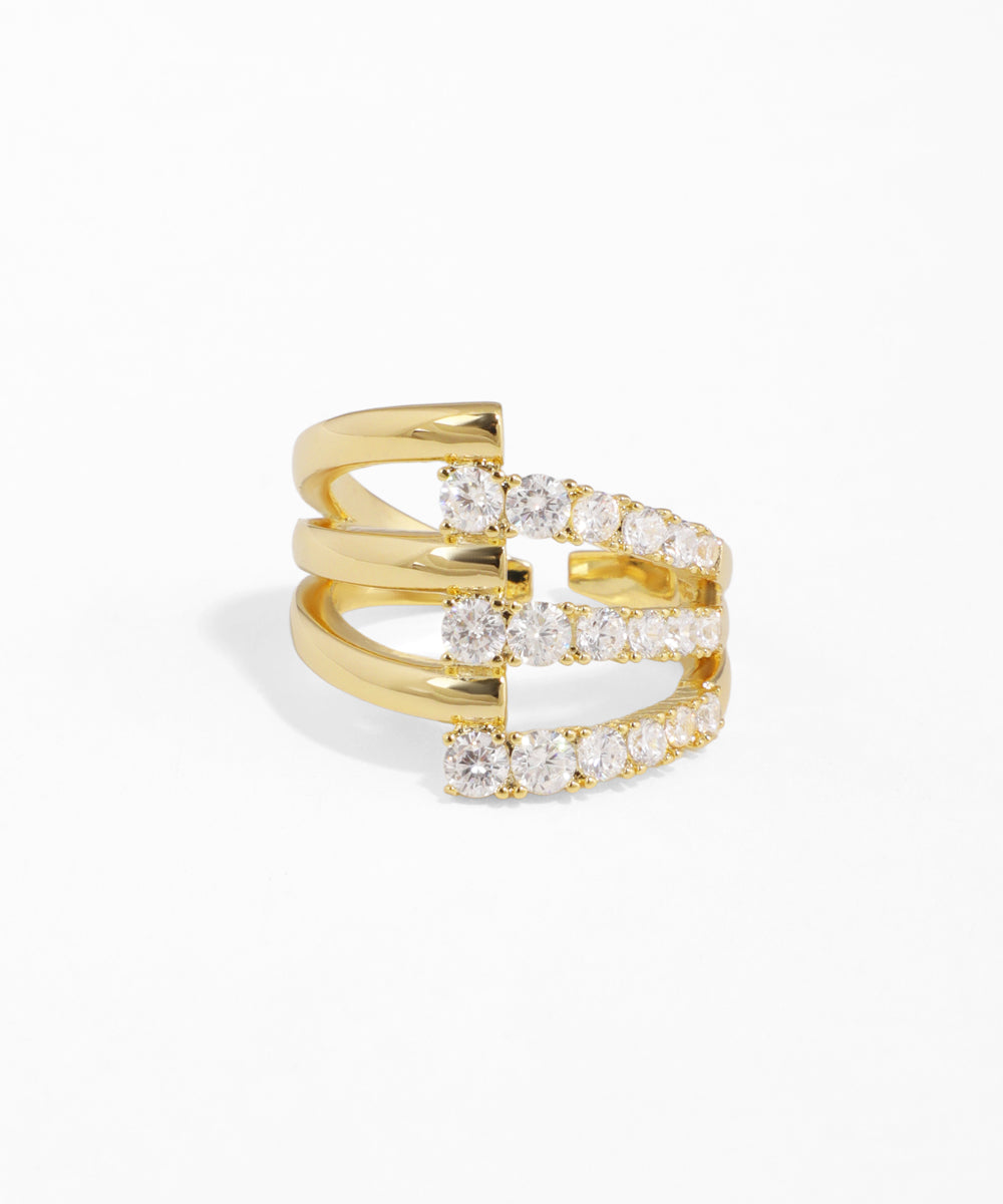 Gold ring with diamond accents on a white background