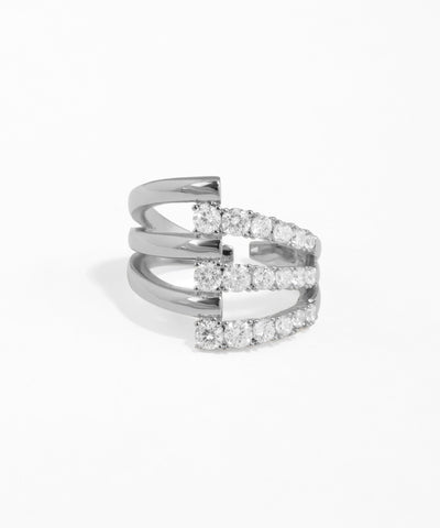 Silver ring with diamond accents on a white background