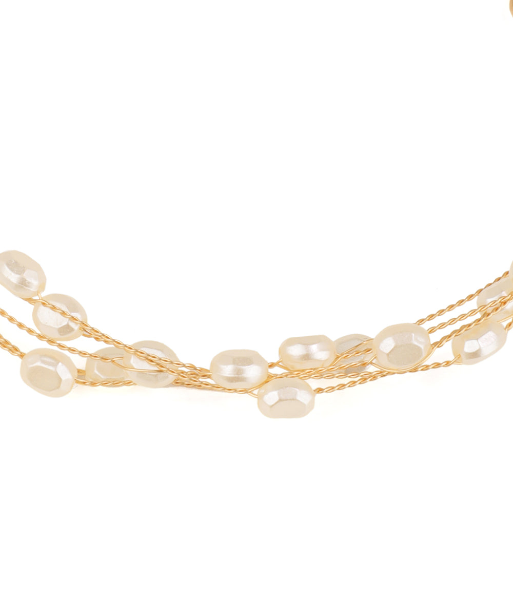 Multi-strand pearl necklace on a white background