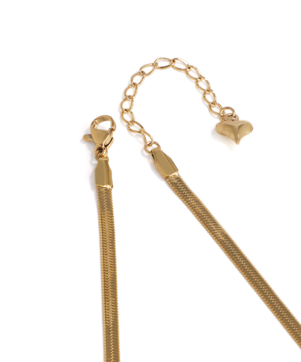 Gold chain necklace on a white background