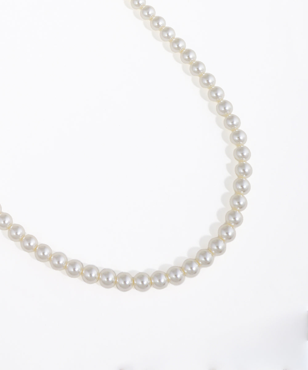 Pearl necklace on a white background