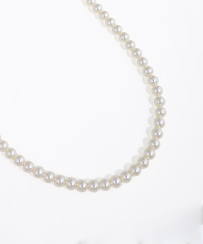 Pearl necklace on a white background