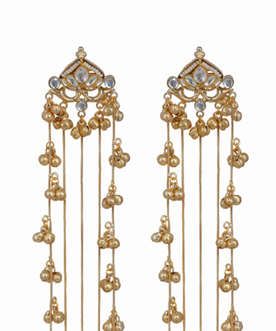 Gold earrings with pearl-like beads on a white background