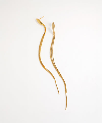 Gold earrings on a white background