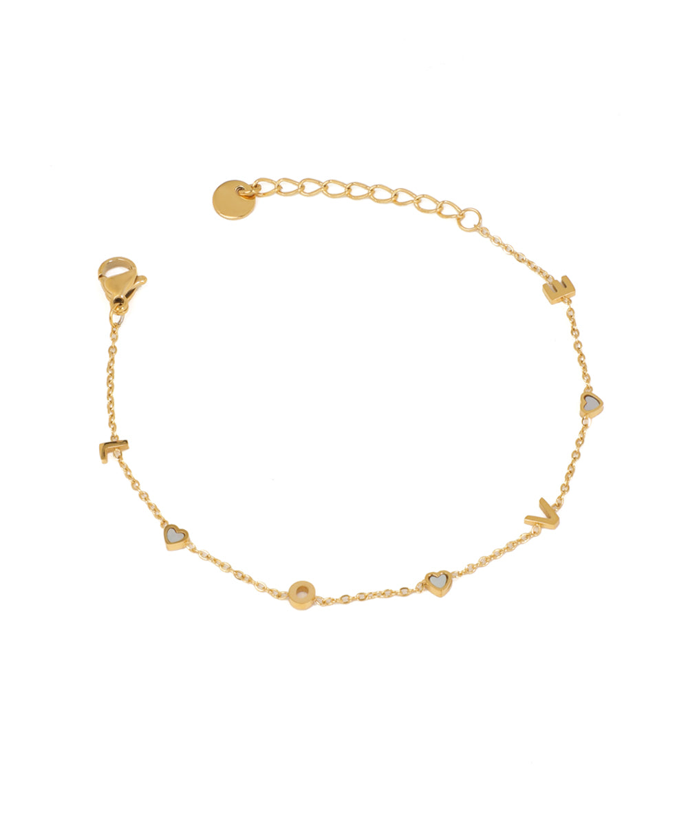 Gold-tone chain bracelet with 'LOVE' letter charms and small iridescent heart inlays, lobster clasp.