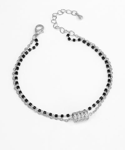 Black and silver beaded bracelet on a white background