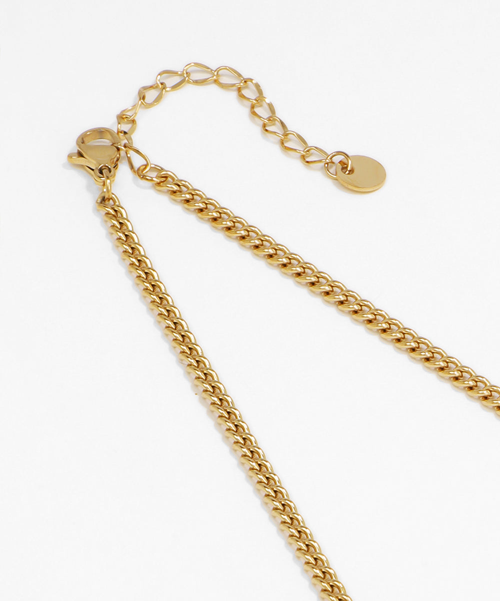 Gold chain necklace on a white background