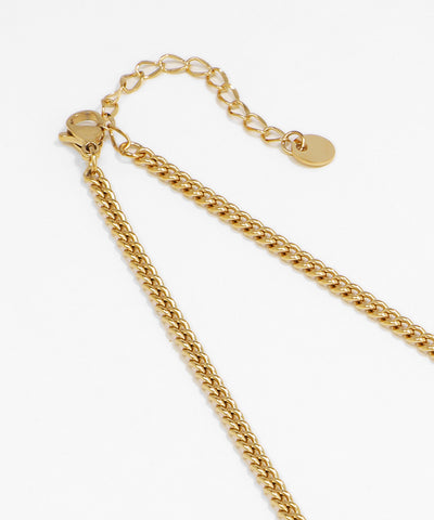 Gold chain necklace on a white background