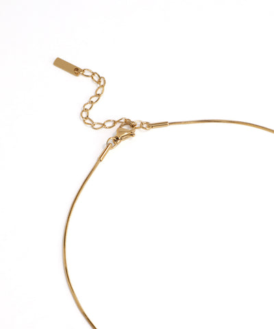 Gold bracelet on a white background