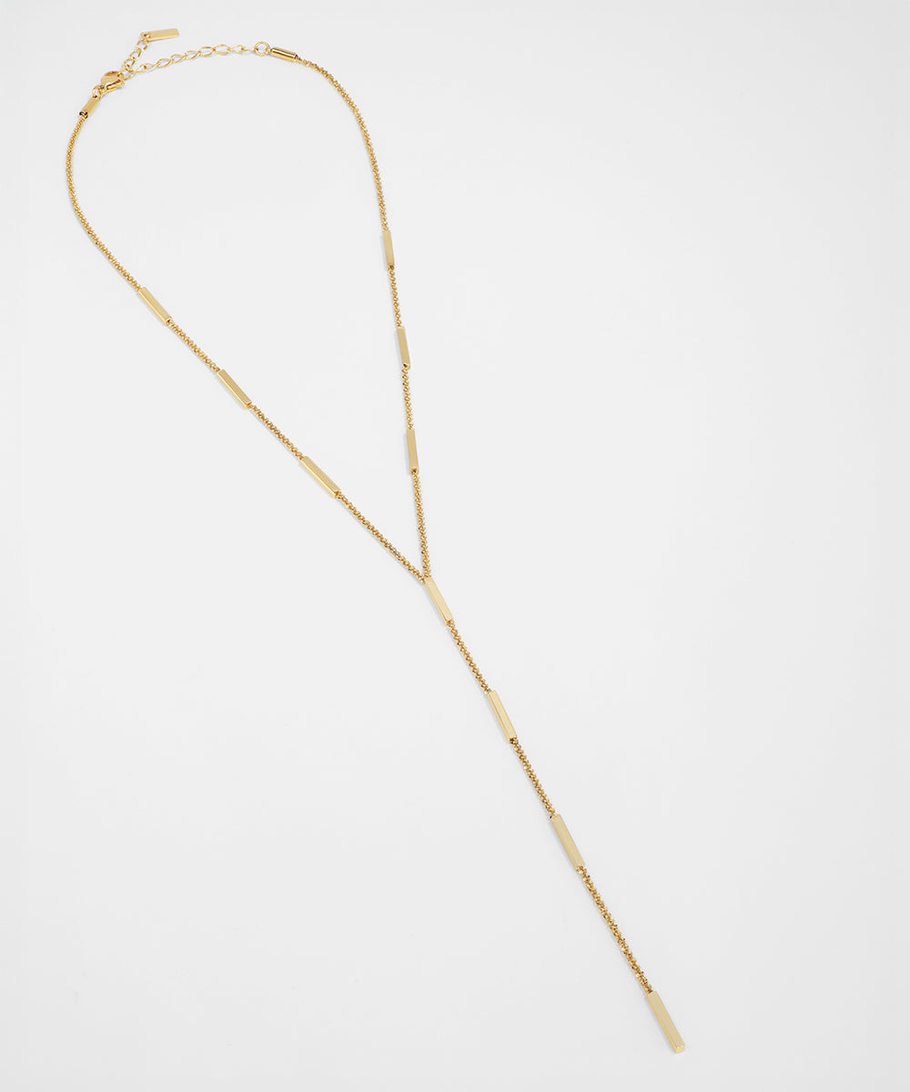 Gold necklace on a white background
