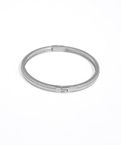 Silver bracelet with clear stones on a white background