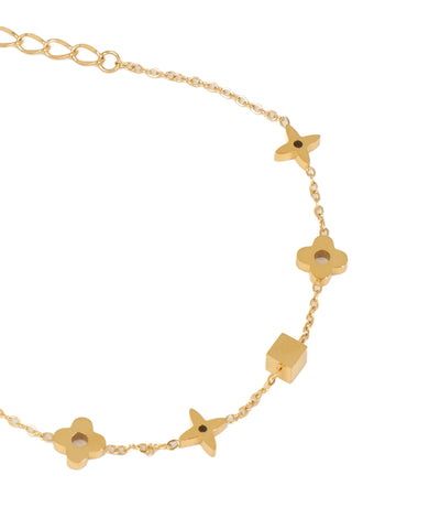 Gold bracelet with star-shaped charms on a white background