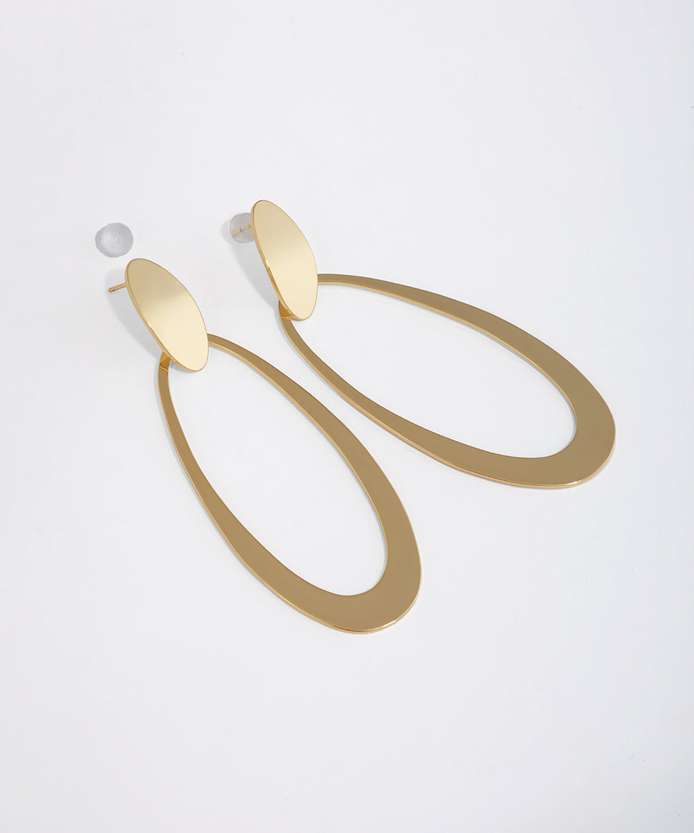 Gold-tone drop earrings with an elongated oval design and flat stud top