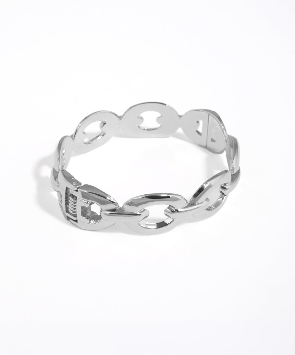 Silver chain-link ring on a white background