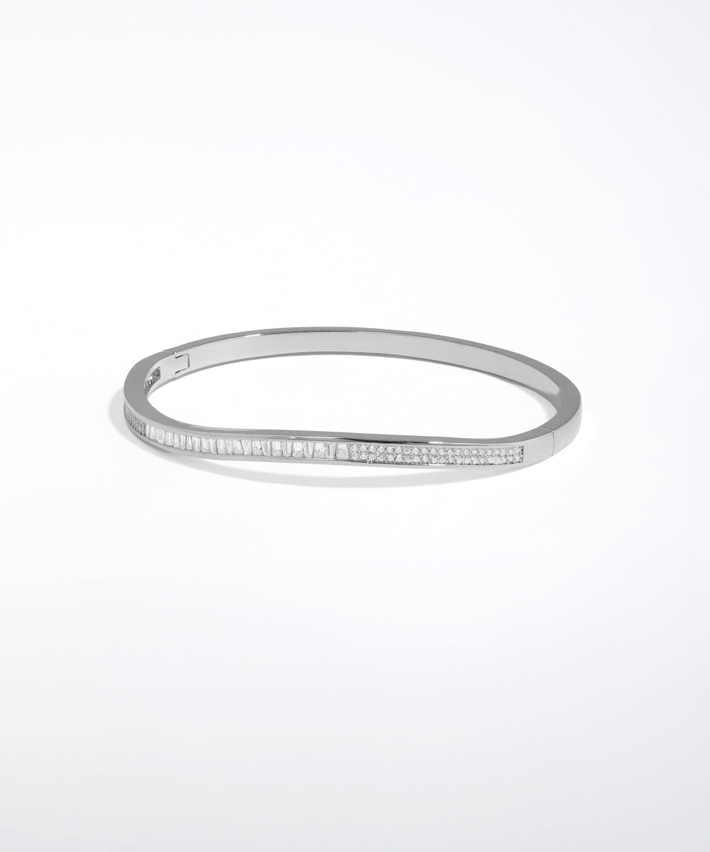 Silver bracelet with small stones on a white background