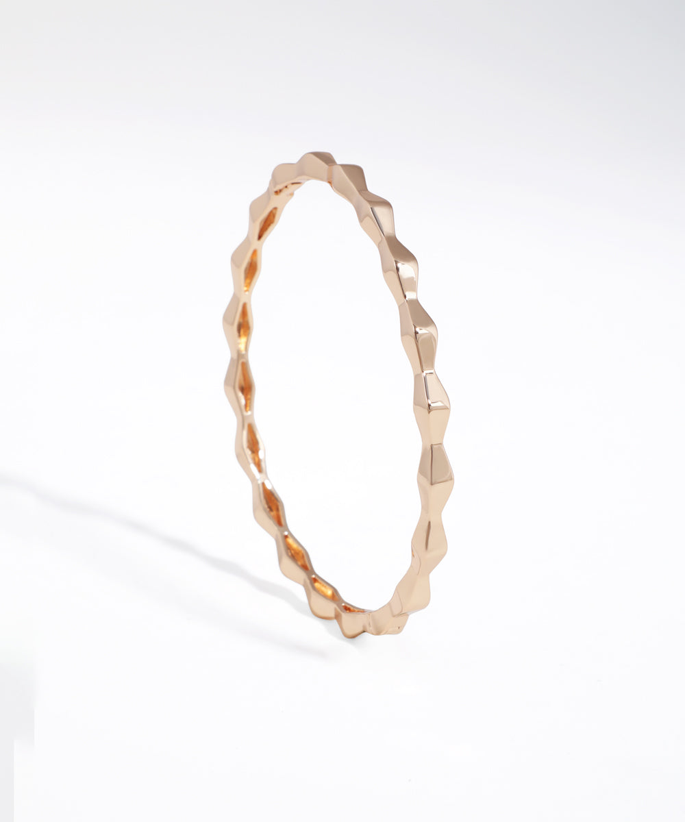 Rose gold bracelet on a white background