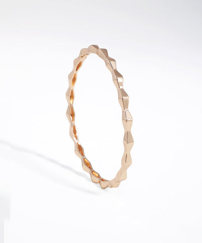Rose gold bracelet on a white background