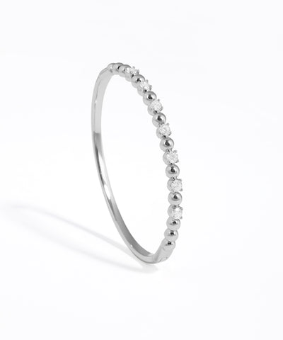Silver ring with small stones on a white background