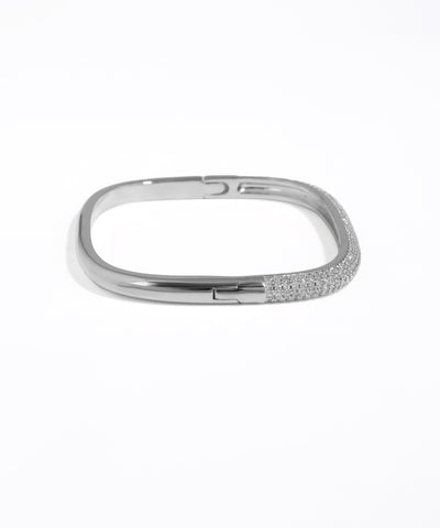 Silver bracelet with small stones on a white background