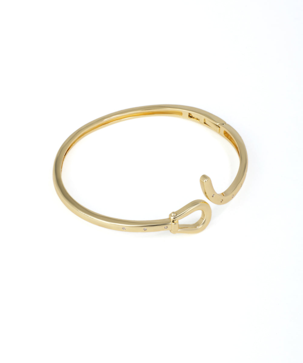 Gold bracelet on a white background