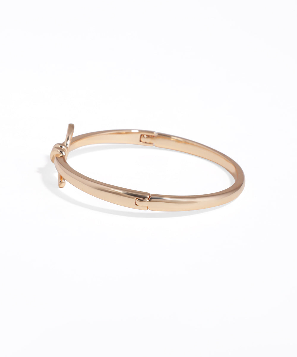 Gold hoop earring on a white background