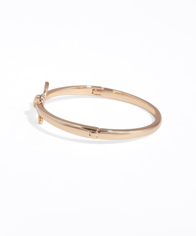 Gold hoop earring on a white background