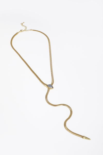 Gold necklace with a small pendant on a white background