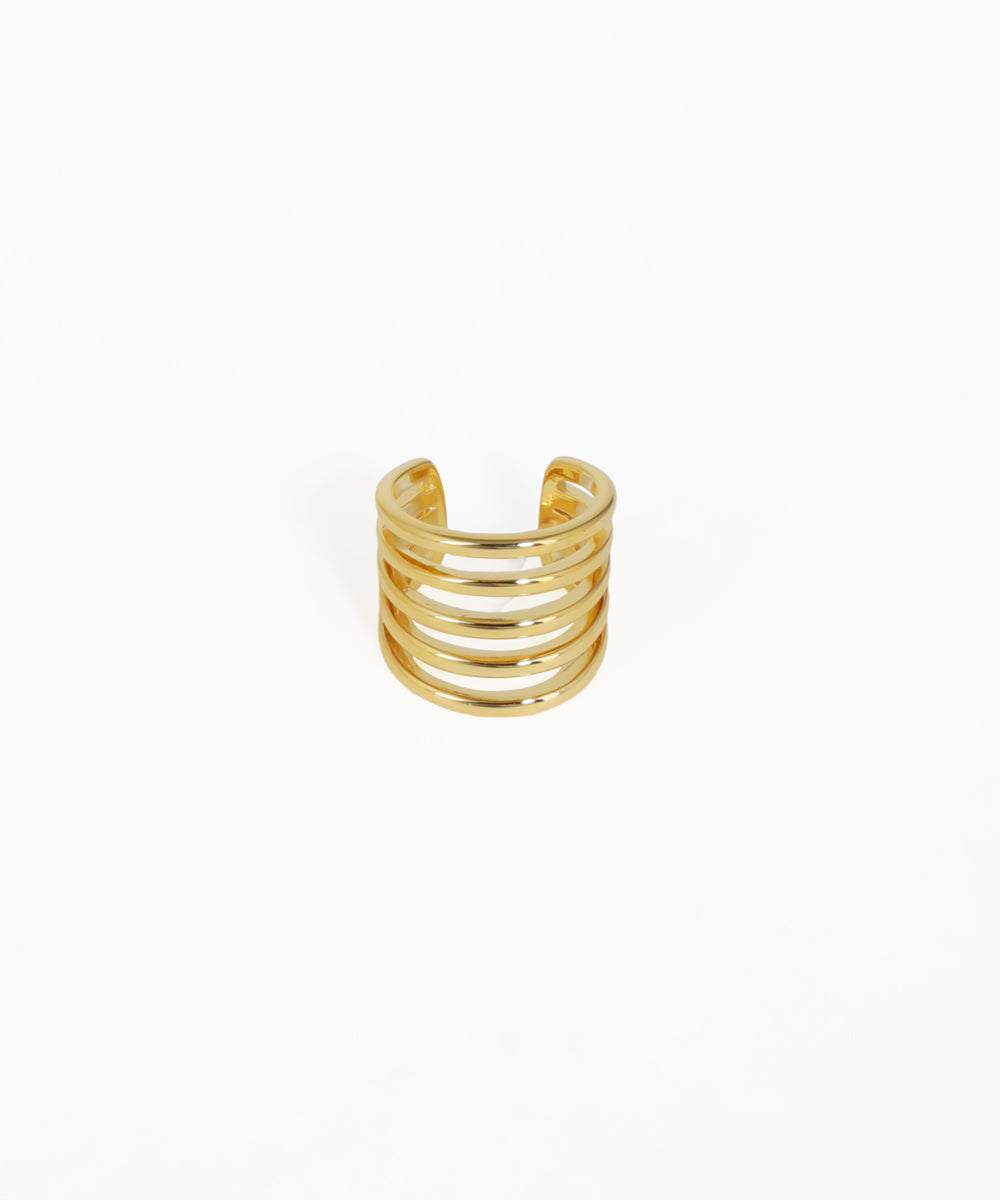 Gold spiral ring on a white background