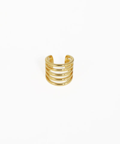 Gold spiral ring on a white background