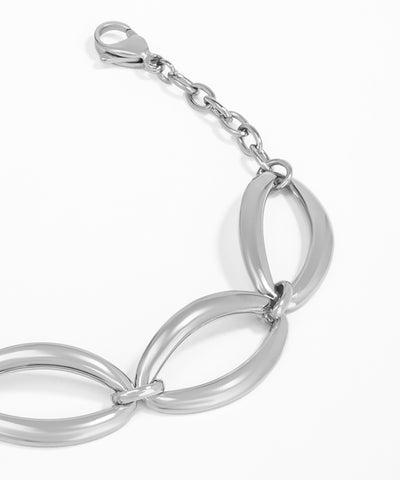 Silver bracelet with interlocking loops on a white background