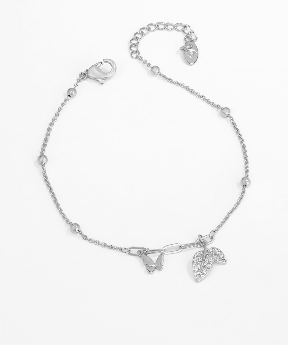 Silver bracelet with leaf charms on a white background