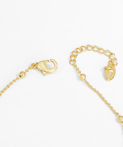 Gold bracelet with clasp on a white background
