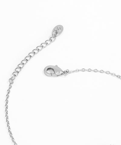 Silver bracelet with clasp on a white background