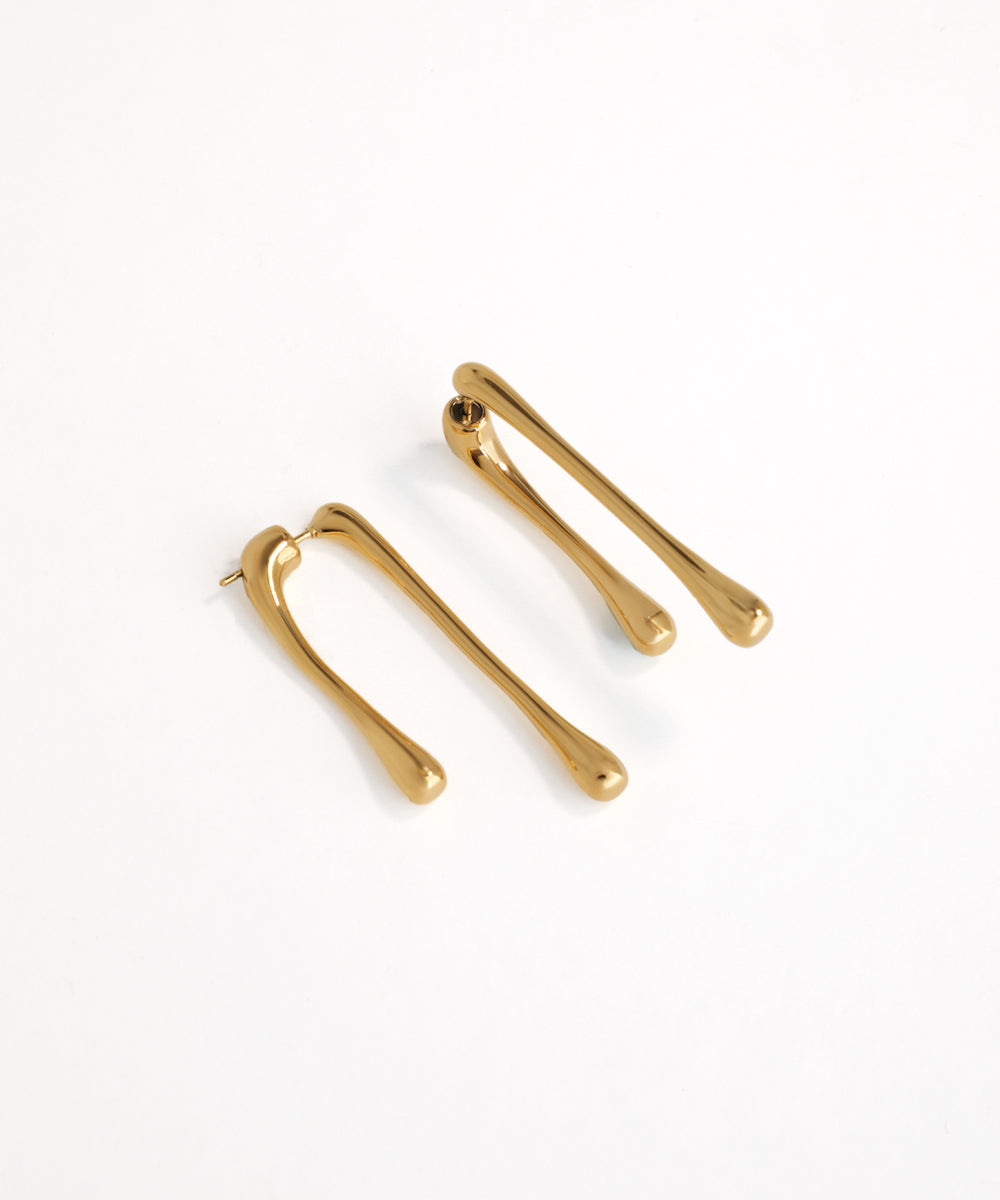 Pair of gold hair clips on a white background