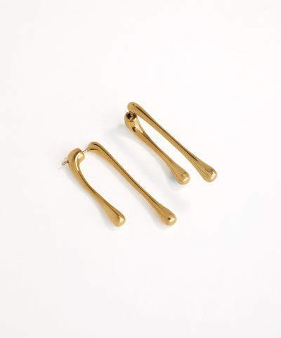 Pair of gold hair clips on a white background