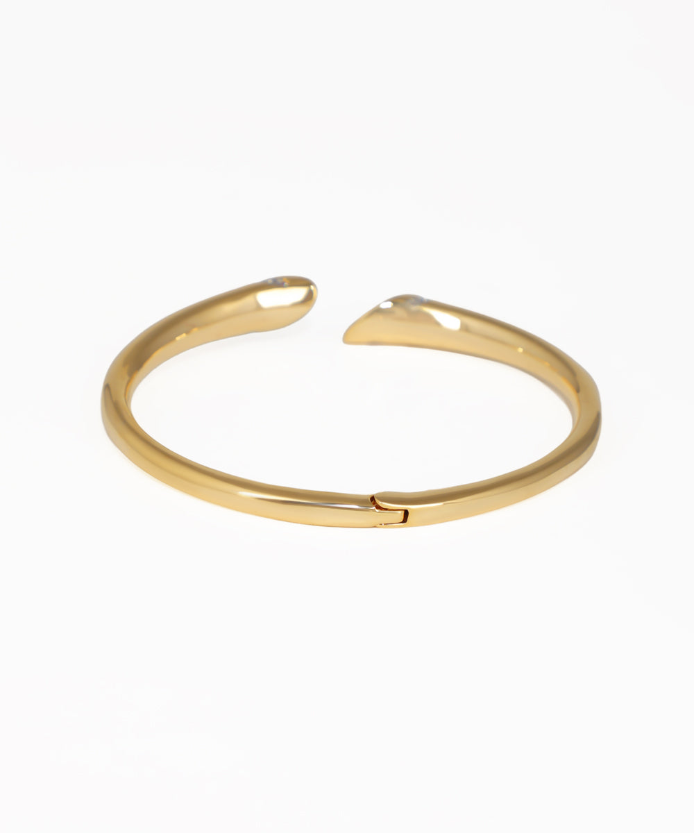 Gold bracelet on a white background