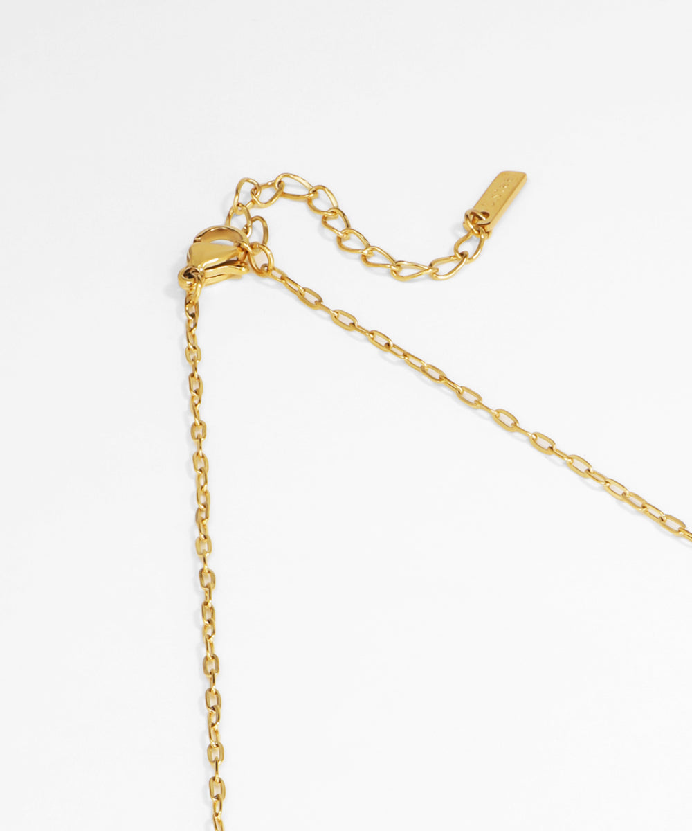 Gold necklace on a white background