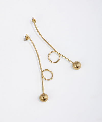 Gold-tone drop earring with a curved linear bar, small loop, and polished sphere at the end