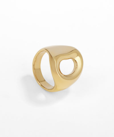 Gold ring with a unique design on a white background